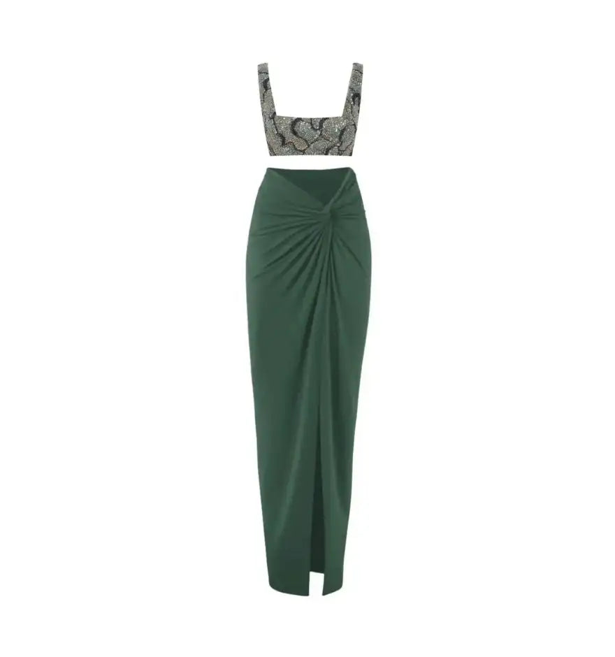 Emerald green high-waisted maxi skirt with a front twist detail and slit.