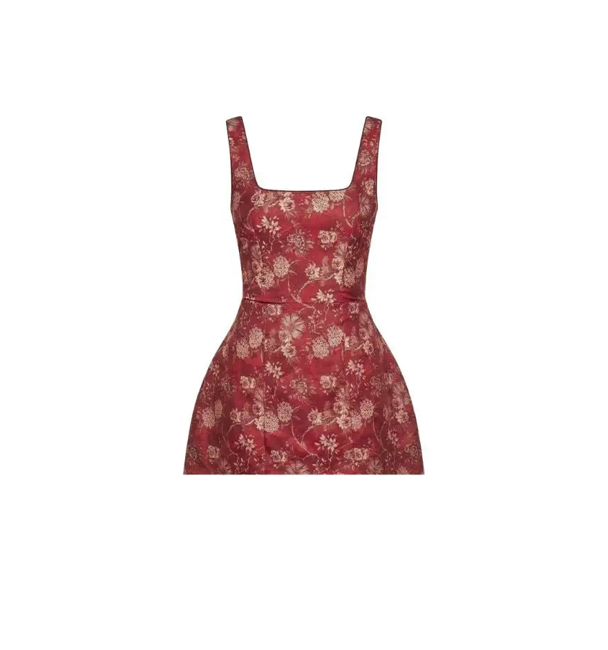 A red floral-patterned sleeveless dress with square neckline and fitted waist.