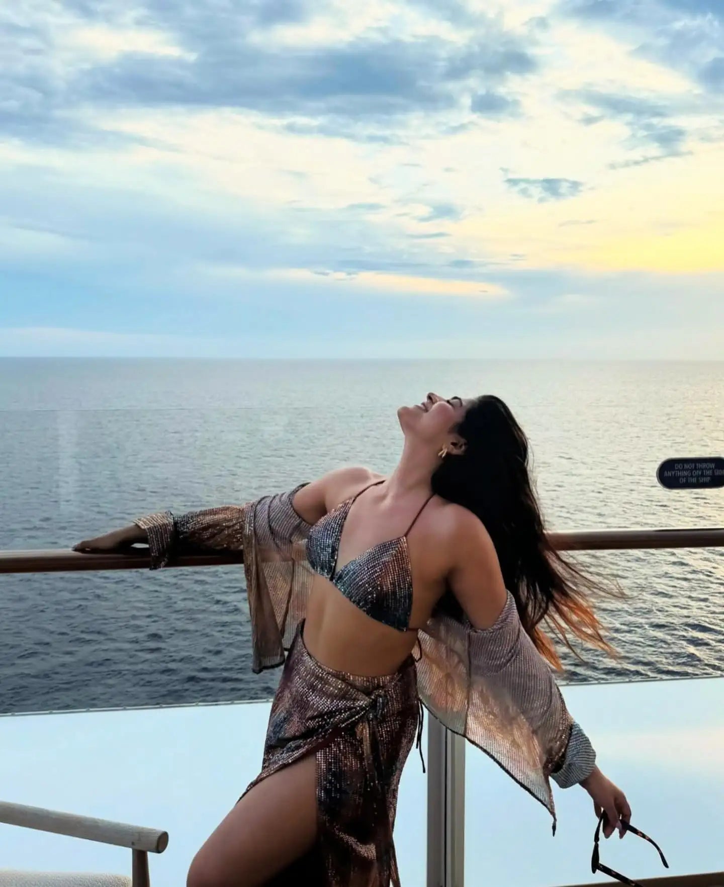 Silver metallic bikini top with a snakeskin pattern and matching bottoms, paired with an open-front kimono-style cover-up.