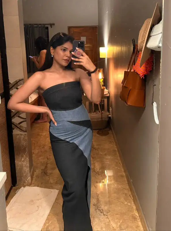 Strapless black and gray dress with a high slit.