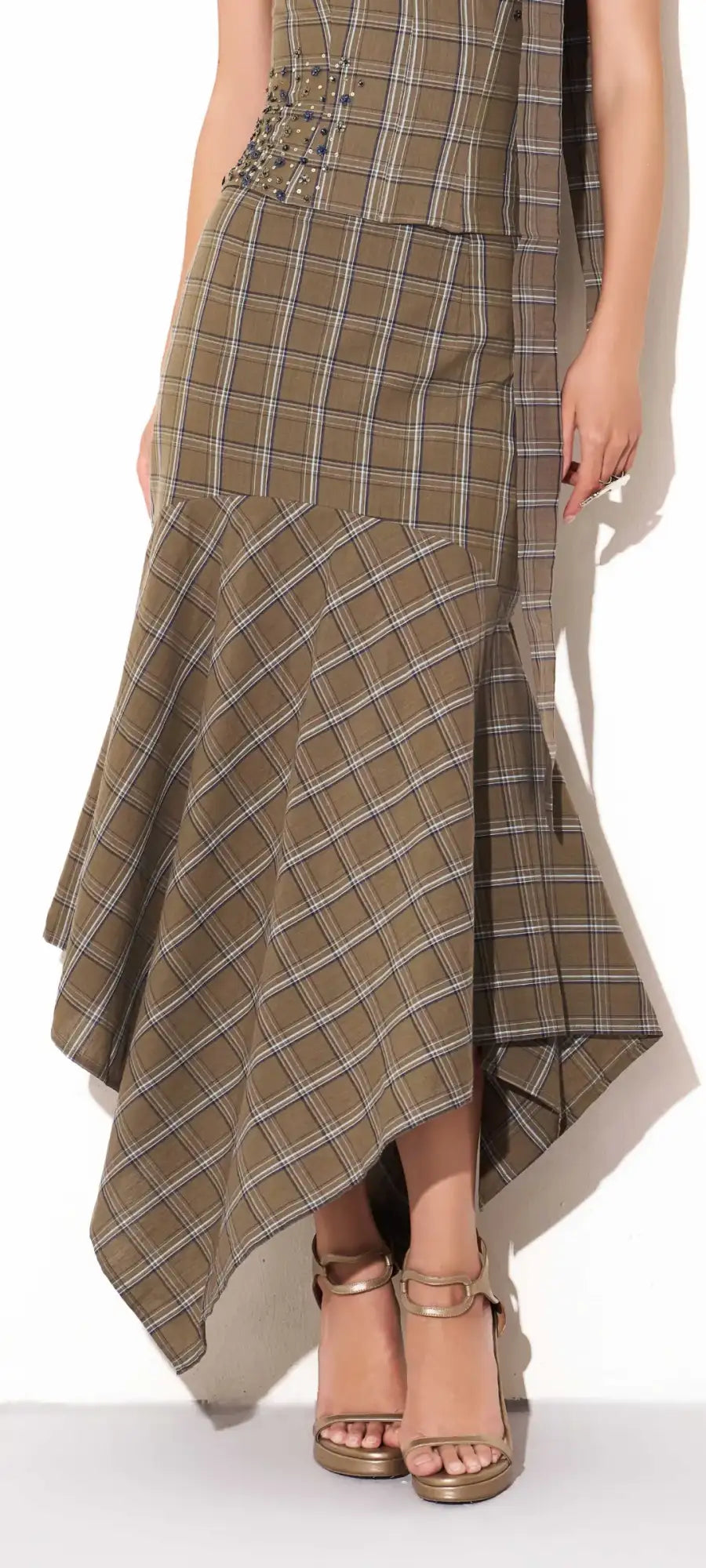 A stylish olive and beige plaid asymmetrical skirt with a flared hemline.