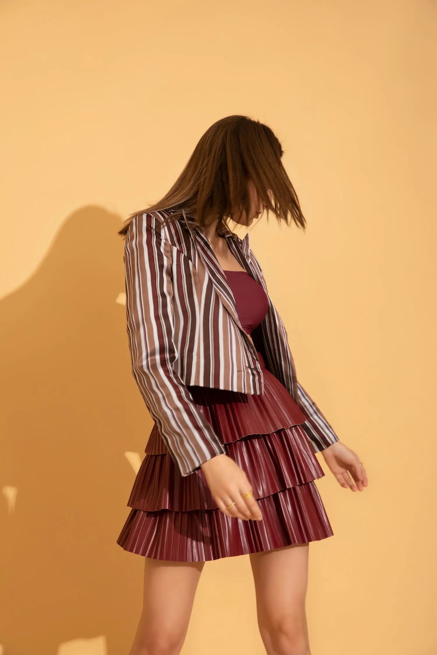 Wine coloured pleated mini skirt in soft comfortable leather from Torqadorn