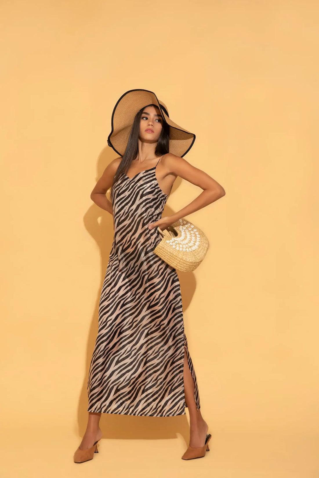 Torqadorn's zebra printed maxi dress in satin georgette, an ideal for beach or summer vacations.