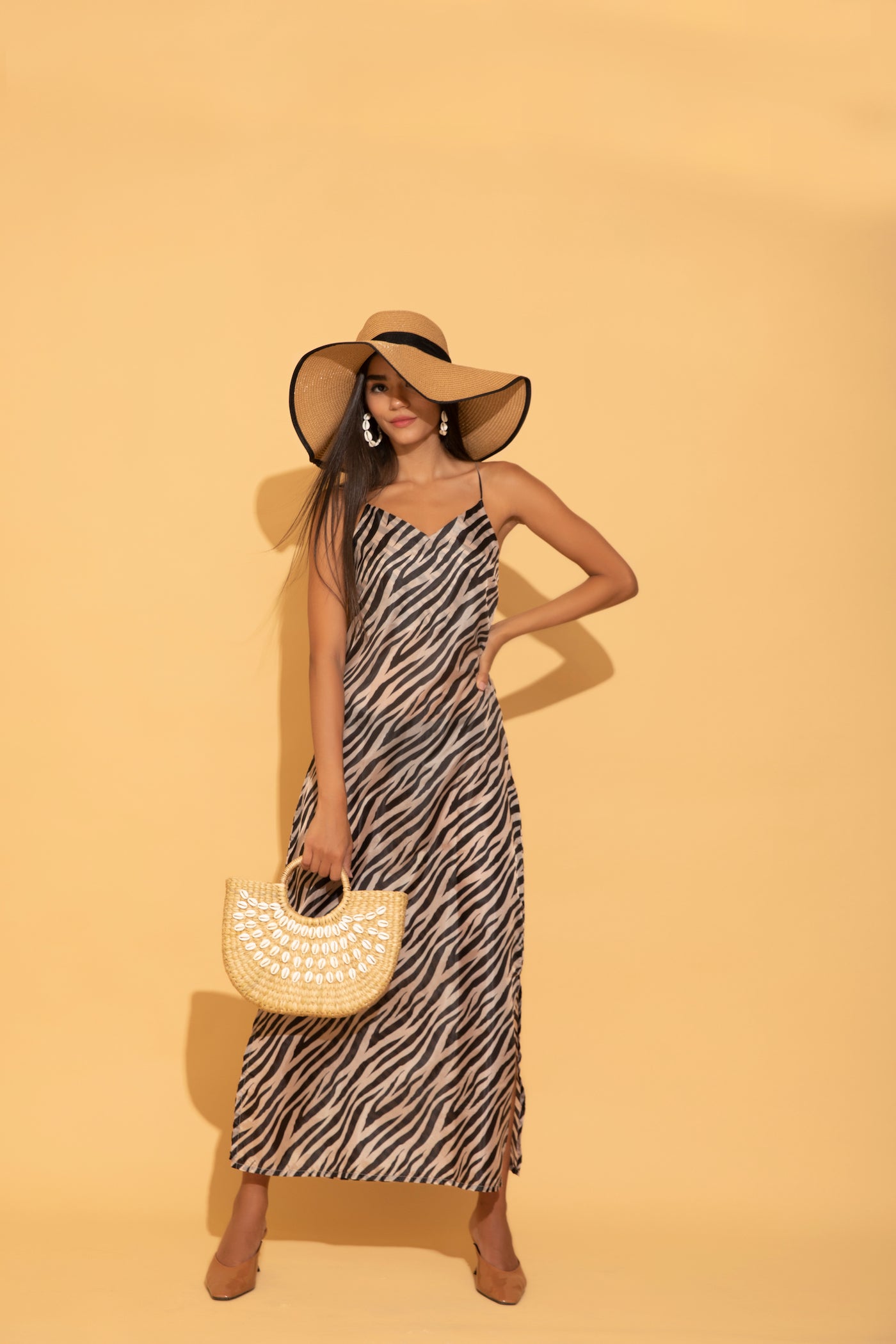 Torqadorn's zebra printed maxi dress in satin georgette, an ideal for beach or summer vacations.