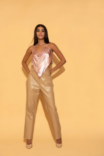 Torqadorn's Beige Leather Pants paired with party wear pink chainmail top