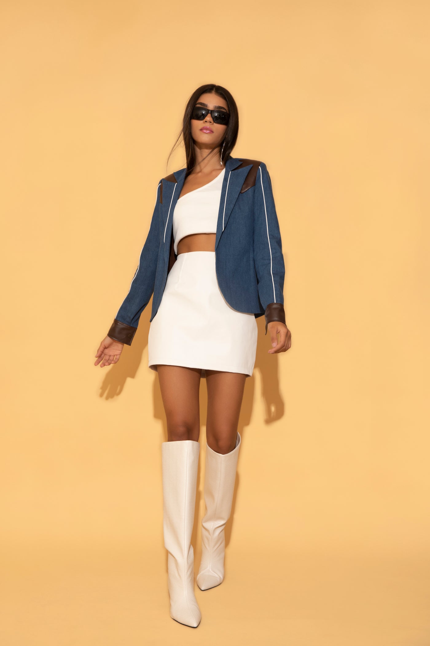 White mini skirt paired with Denim for a stylish look