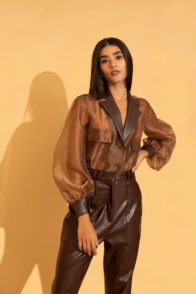 Classy organza with fine leather detailing from Torqadorn paired with brown leather pants